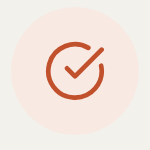 The completion mark as the running app draws it: an orange check on a pale disc.